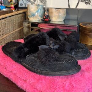 UGG black suede slip on slippers with fur Pom Poms and Bows. Size 8. Good